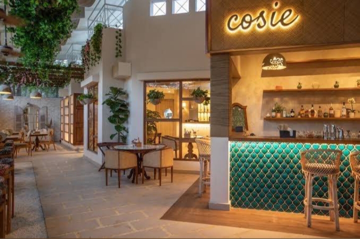 The teal fish-scale cocktail bar